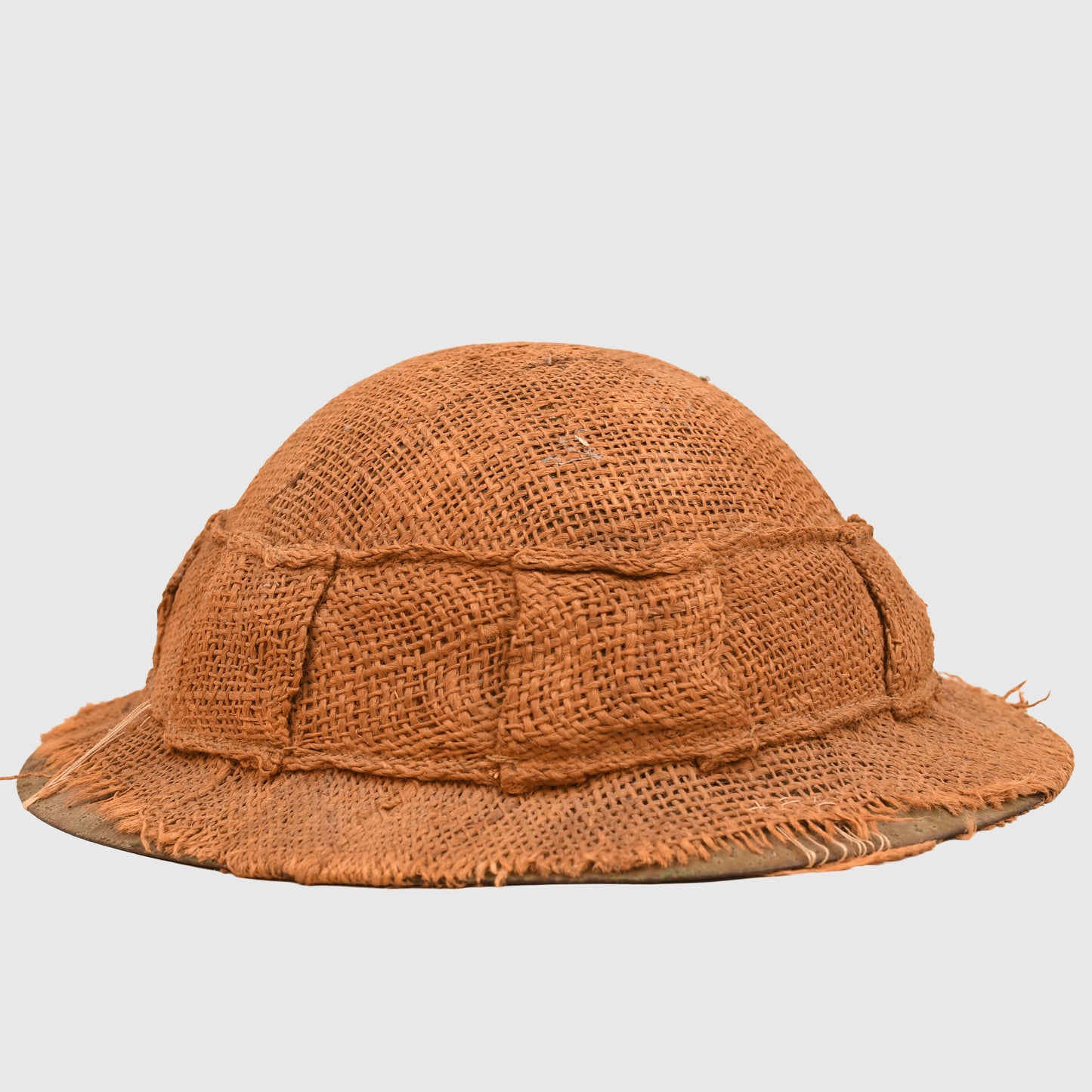 BRITISH WWI 1ST PATTERN BRODIE HELMET WITH A RARE TYPE OF SACKING COVER