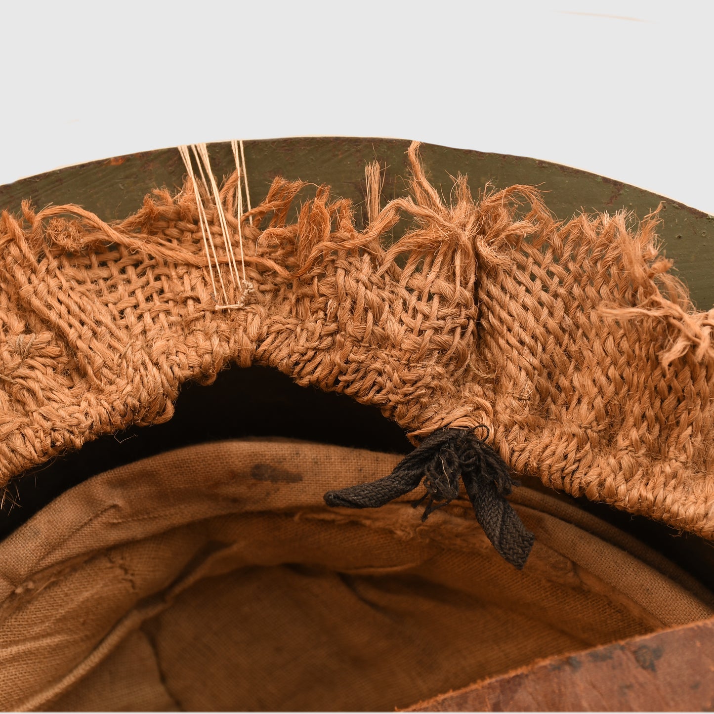 BRITISH WWI 1ST PATTERN BRODIE HELMET WITH A RARE TYPE OF SACKING COVER