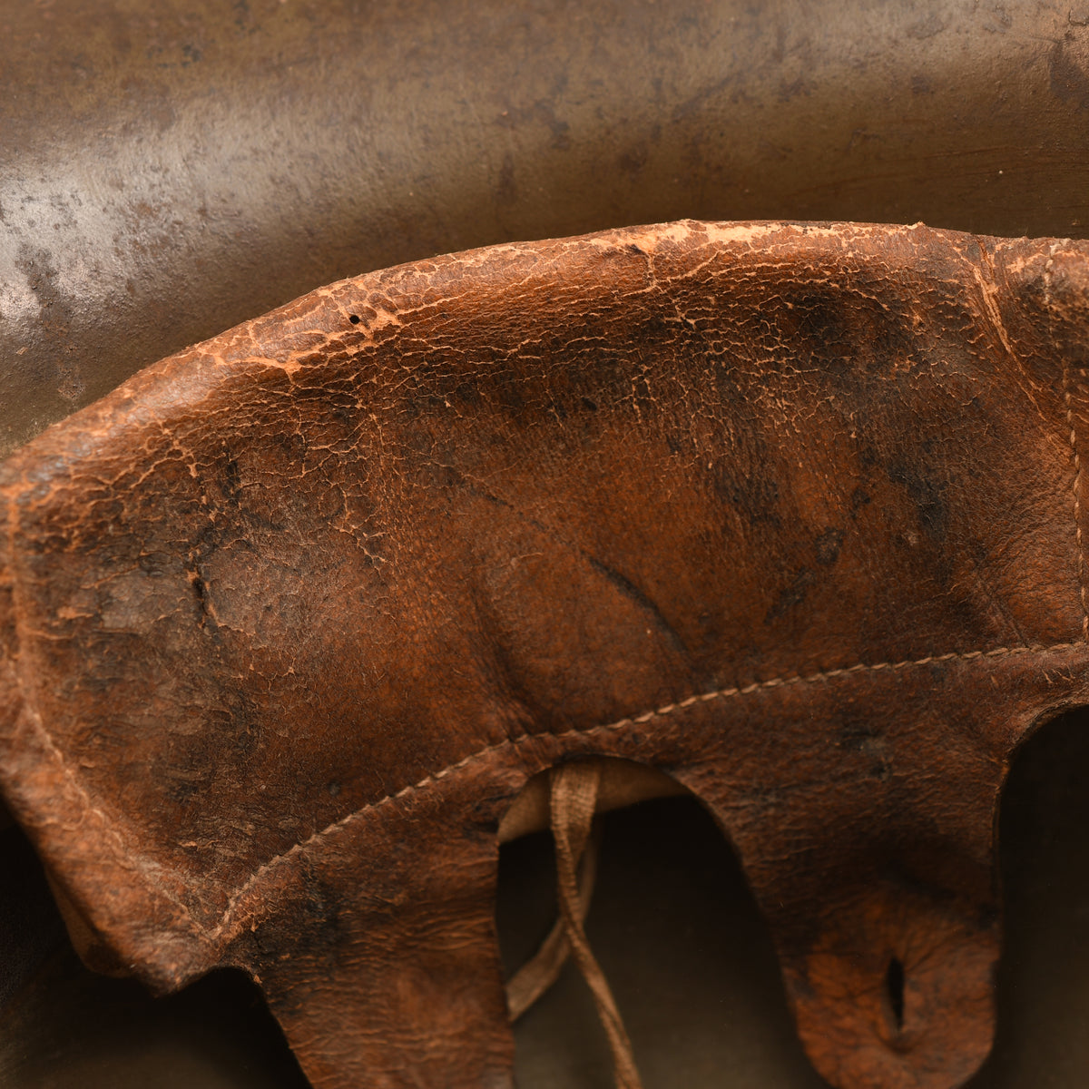 GERMAN WWI M.16 CAMOUFLAGE TRENCH HELMET WITH PARTIAL CHINSTRAP