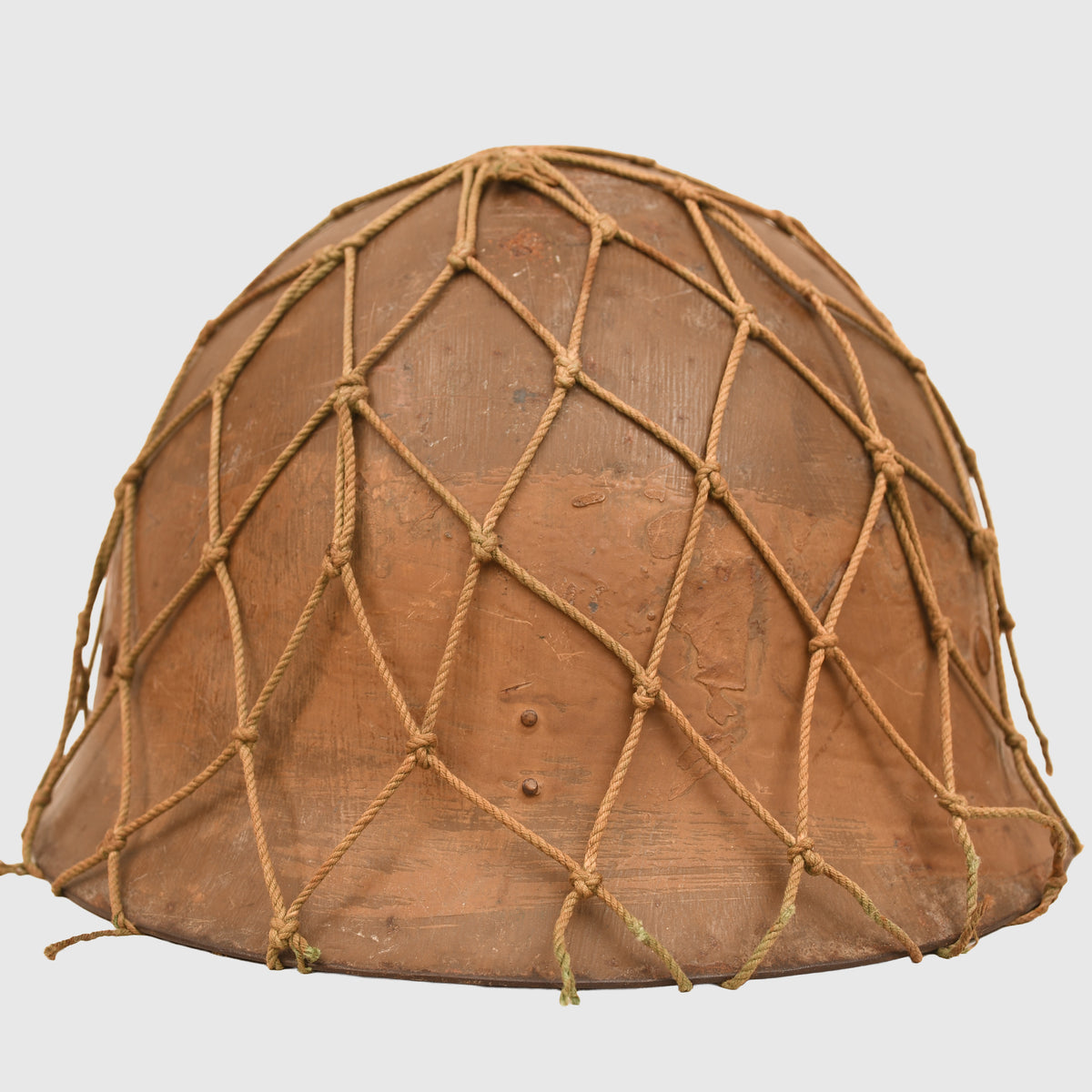 JAPANESE WWII TYPE 90 COMBAT HELMET WITH CAMOUFLAGE NET, IDENTIFIED TO AN INDIVIDUAL SOLDIER