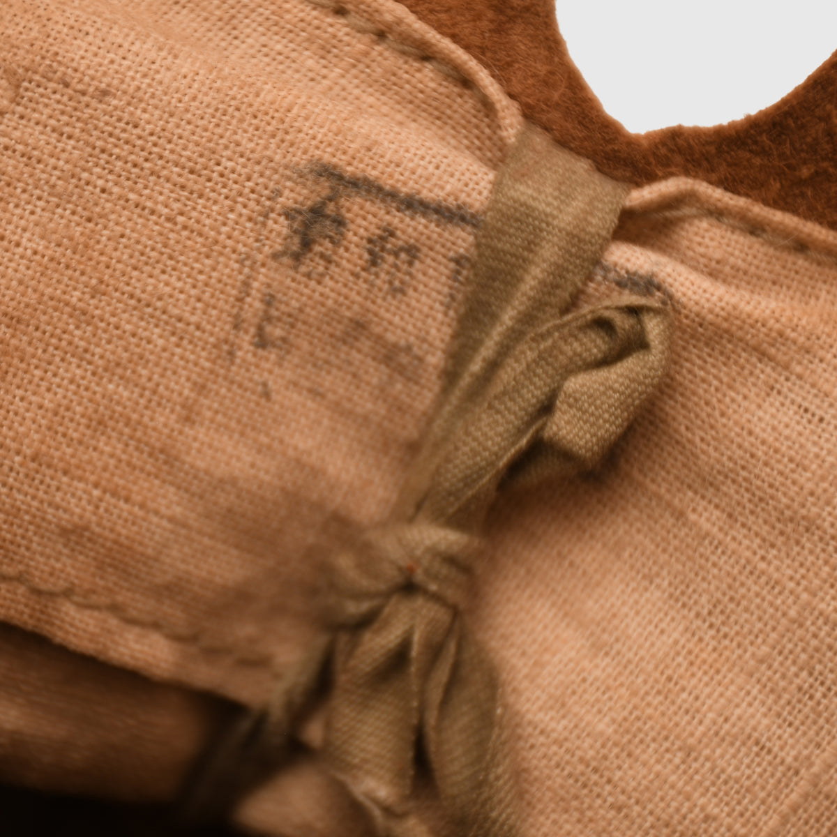 JAPANESE WWII TYPE 90 COMBAT HELMET WITH CAMOUFLAGE NET, IDENTIFIED TO AN INDIVIDUAL SOLDIER