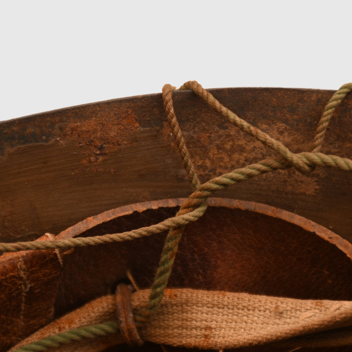 JAPANESE WWII TYPE 90 COMBAT HELMET WITH CAMOUFLAGE NET, IDENTIFIED TO AN INDIVIDUAL SOLDIER